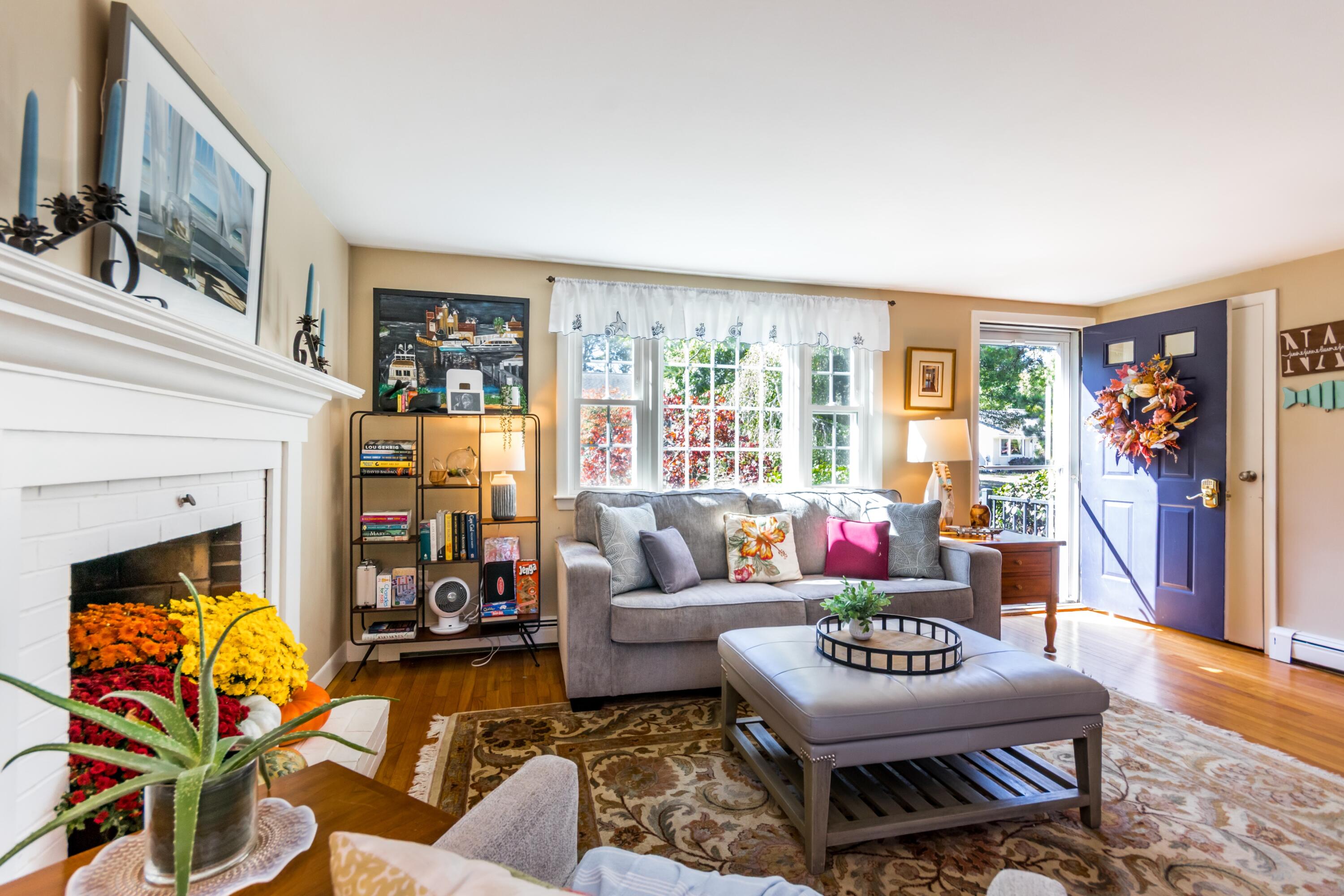 42 Agnes Road South Dennis, MA 02660 - Photo 6 of 36 a living room with furniture a fireplace and a large window
