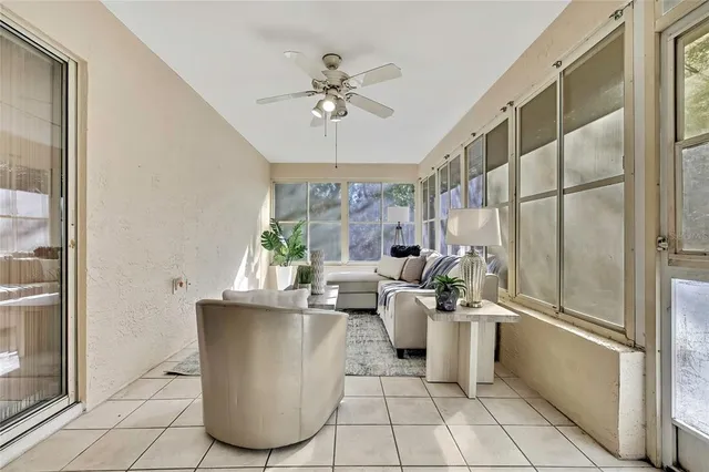 a living room with furniture and a large window