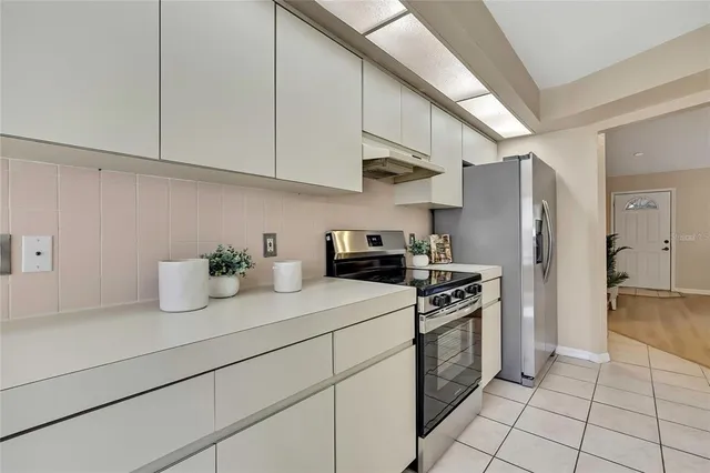 a kitchen with sink and cabinets