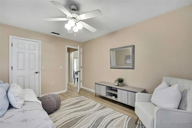 a bathroom with a granite countertop sink mirror and toilet
