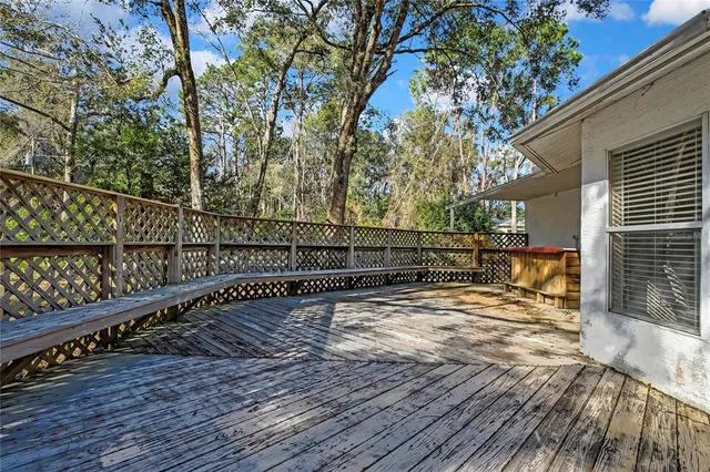 a view of outdoor space and wooden deck