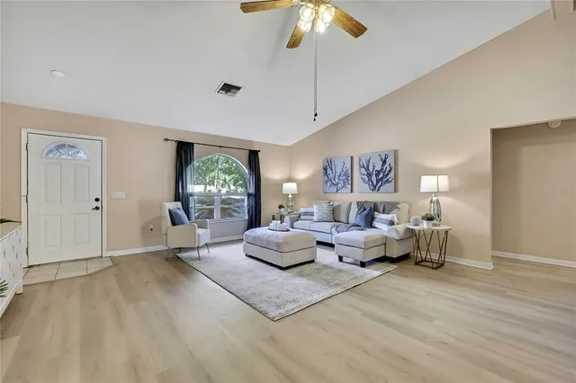 a living room with furniture and a large window