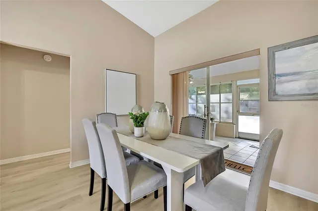 a living room with a table and chairs