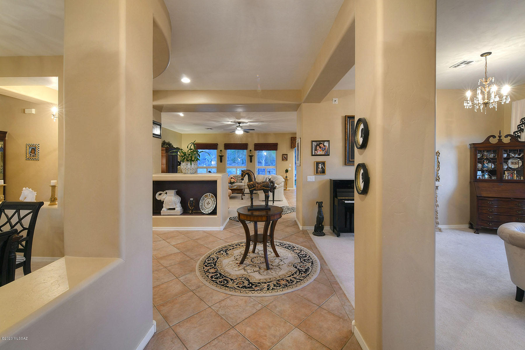 12740 North Morgan Ranch Road Oro Valley, AZ 85755 - Photo 32 of 32 a room with kitchen island furniture and a chandelier