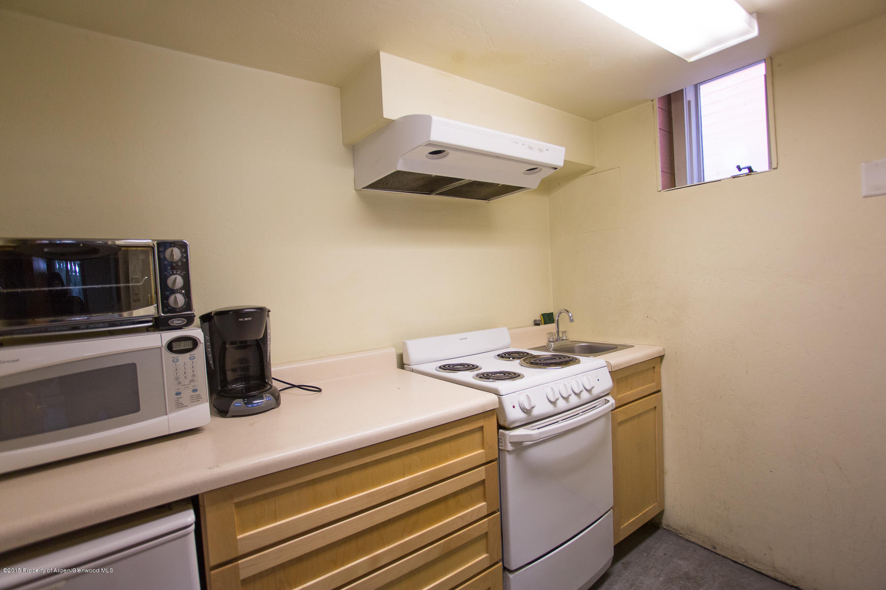 520 West Main Street, Unit 2 Aspen, CO 81611 - Photo 6 of 7 a kitchen with a stove and a microwave