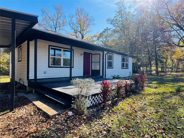 a view of a swimming pool with trees in the background