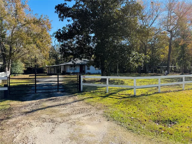 a view of a swimming pool with an outdoor seating and yard