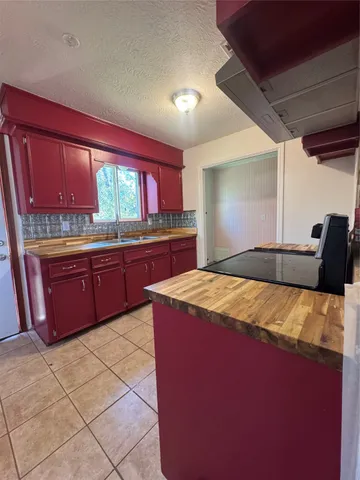 a bedroom with a bed and a television