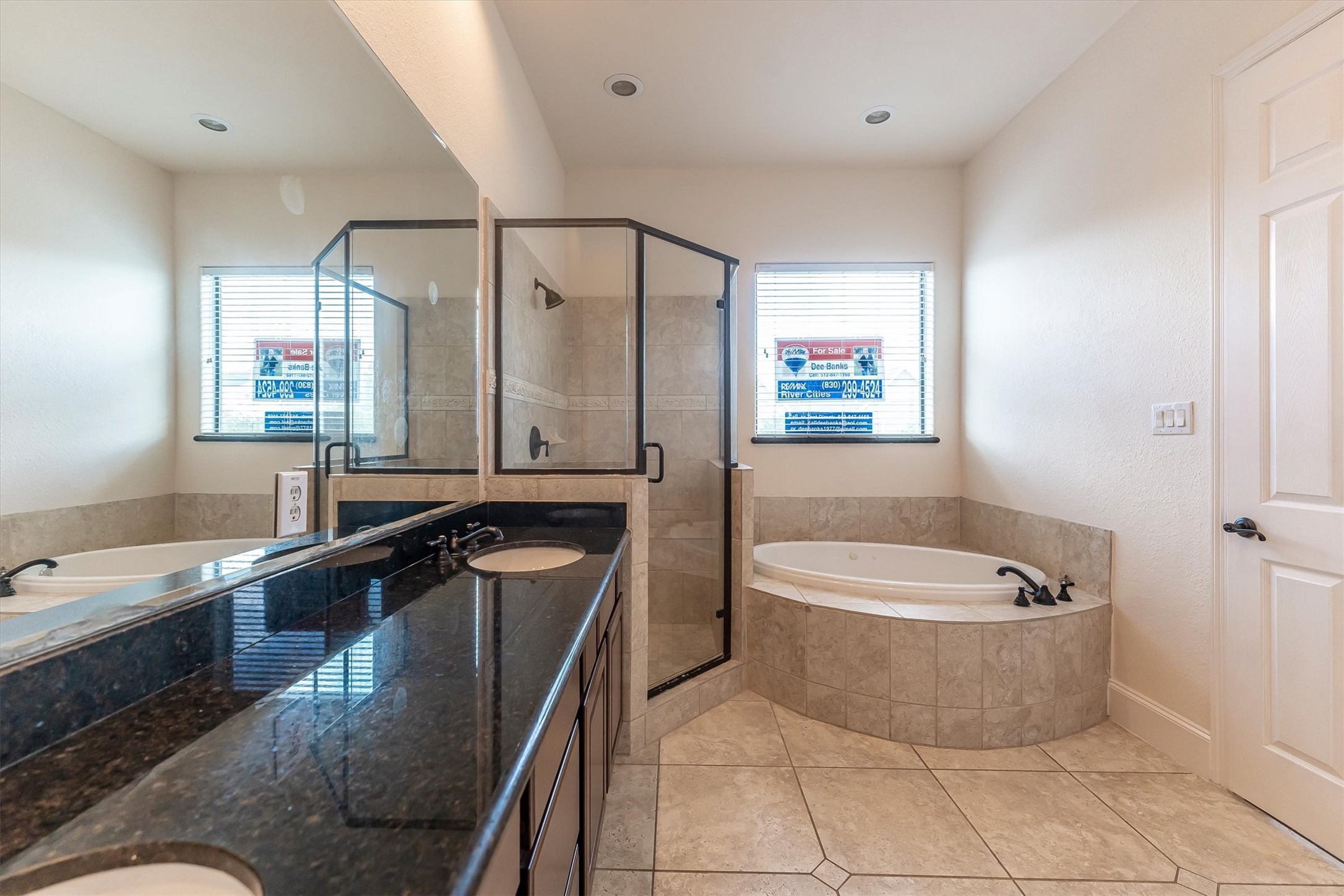 308 Grove Street Houston, TX 77020 - Photo 22 of 28 a bathroom with a tub a sink and mirror