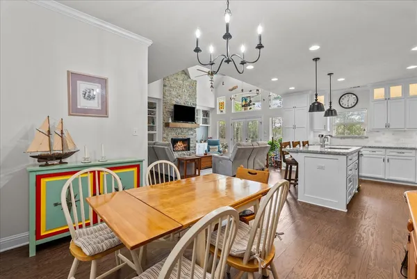 a kitchen with counter top space a sink appliances and cabinets
