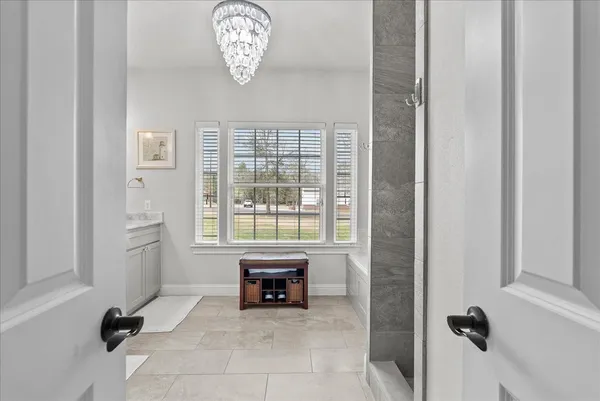 a view of a livingroom with workspace and a window