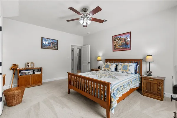 a view of a livingroom with workspace and a window