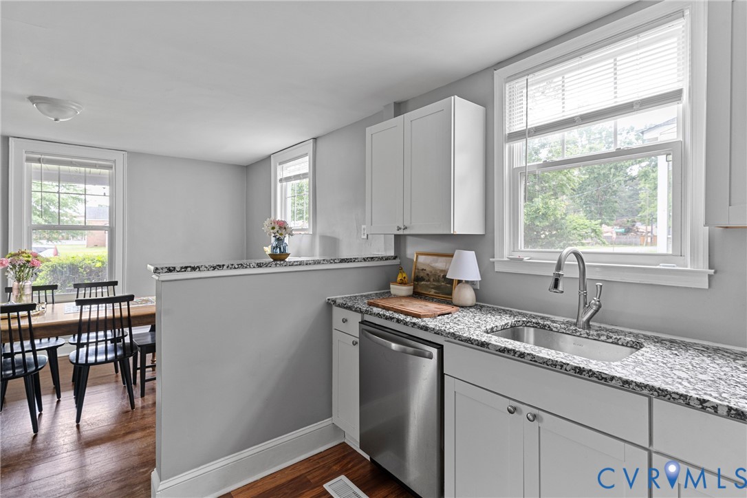 104 West Union Street Sandston, VA 23150 - Photo 14 of 33 a kitchen with stainless steel appliances granite countertop sink window and cabinets