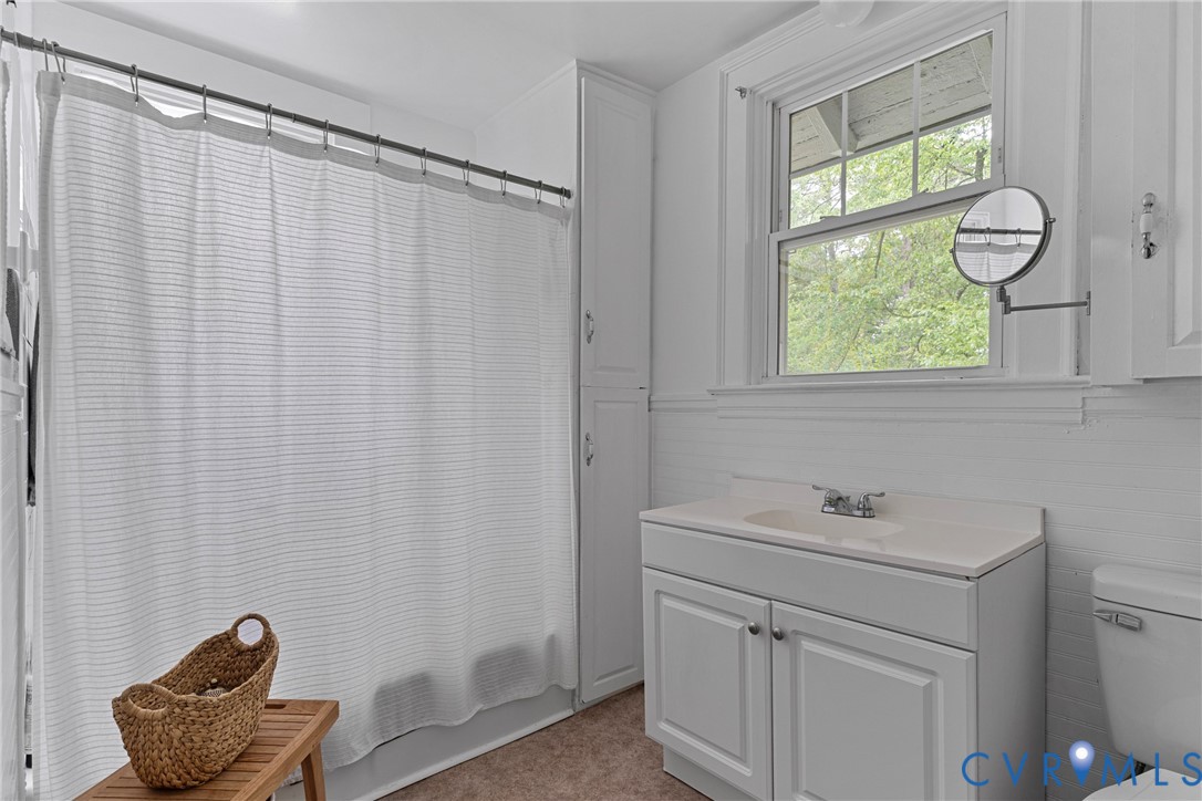 104 West Union Street Sandston, VA 23150 - Photo 26 of 33 a bathroom with a sink a vanity and a shower