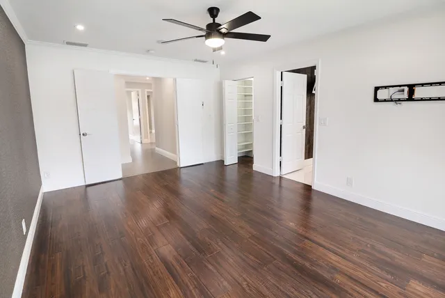 a white bath tub sitting next to a white sink