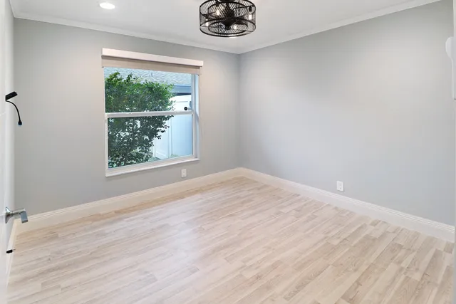 a bathroom with a granite countertop toilet sink and a mirror