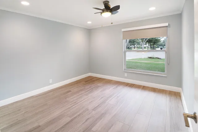 a view of an empty room with a window