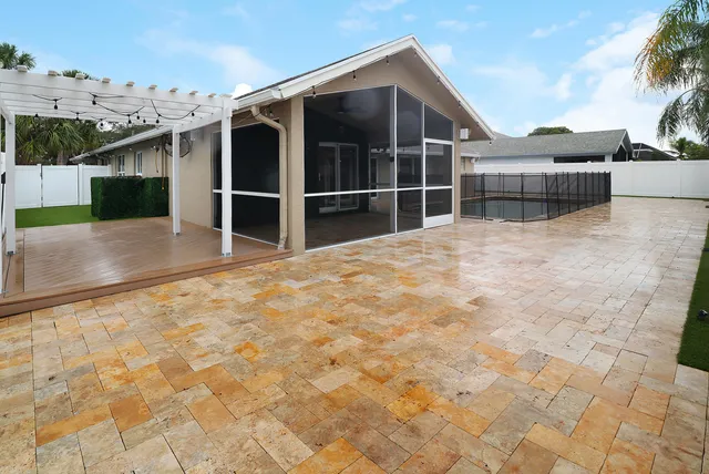 an aerial view of a residential houses with yard