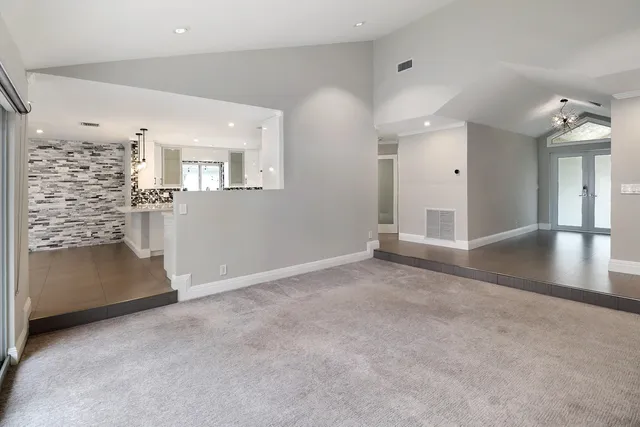 a view of kitchen with granite countertop cabinets and stove