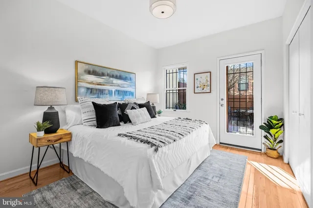 a bedroom with bed and a window