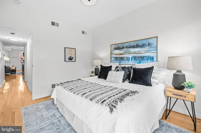 a bed room with a bed and a chair