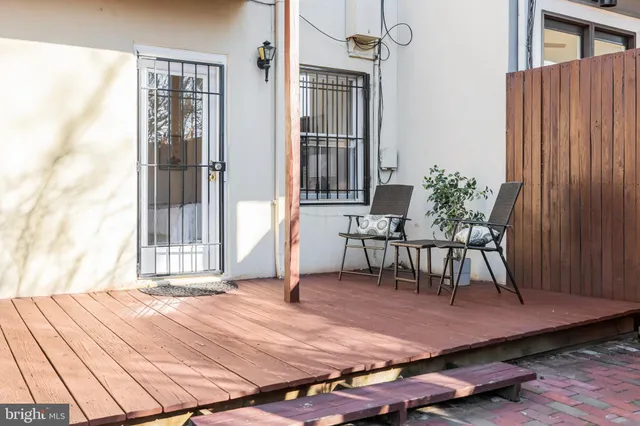 a patio with table and chairs