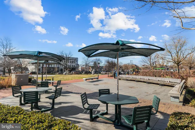 a view of a swimming pool with outdoor seating