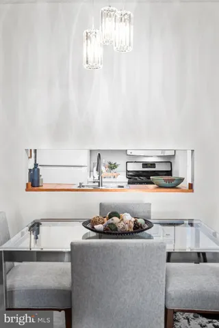 a kitchen with a sink a stove and a microwave