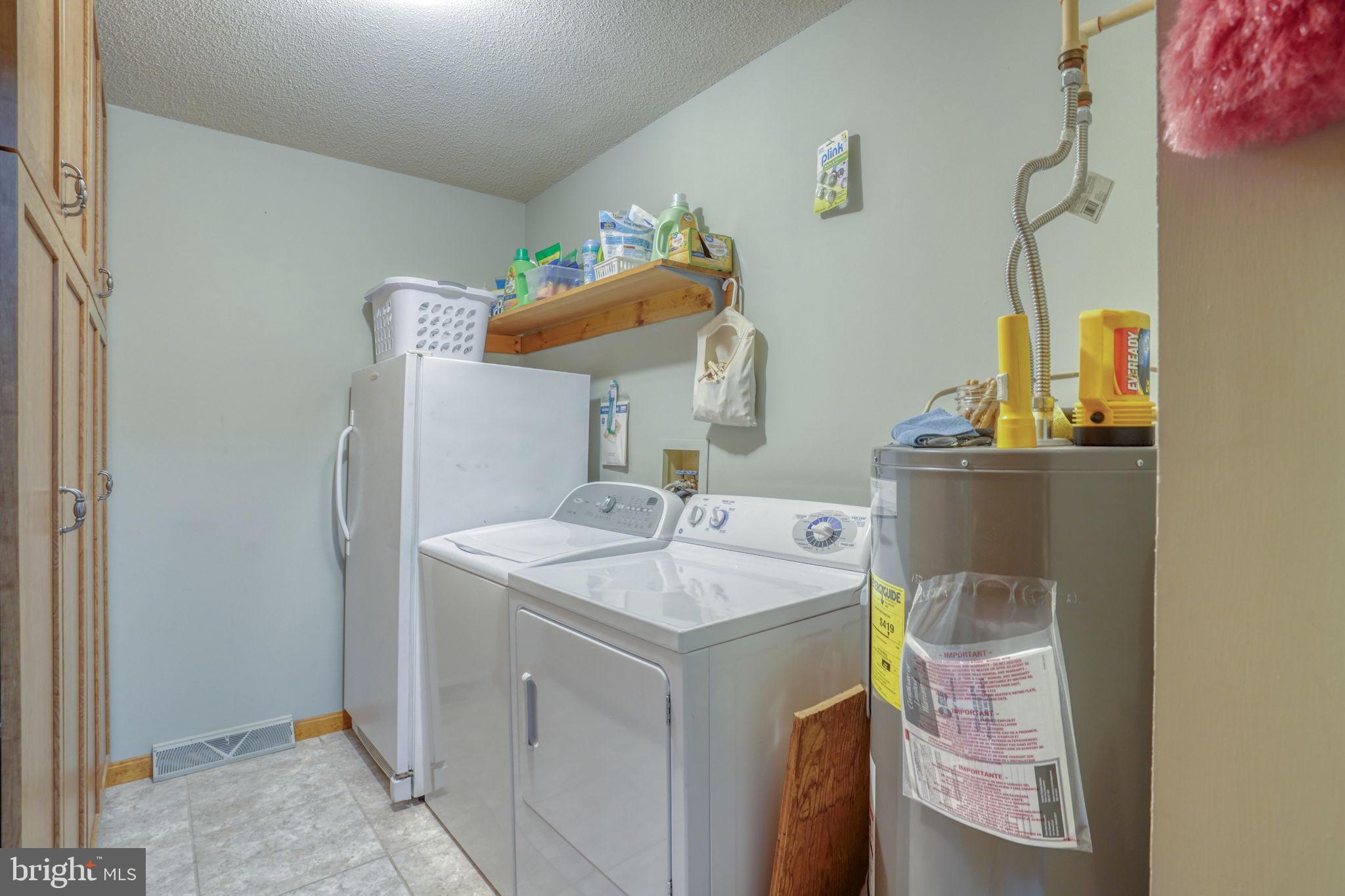 1916 Hartly Road Hartly, DE 19953 - Photo 20 of 44 a utility room with cabinets washer and dryer