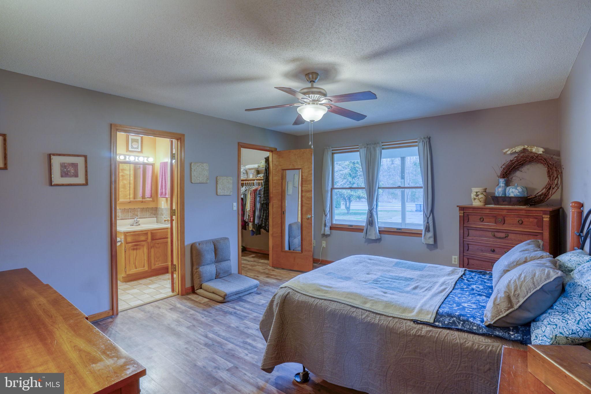 1916 Hartly Road Hartly, DE 19953 - Photo 22 of 44 a bedroom with a bed and wooden floor