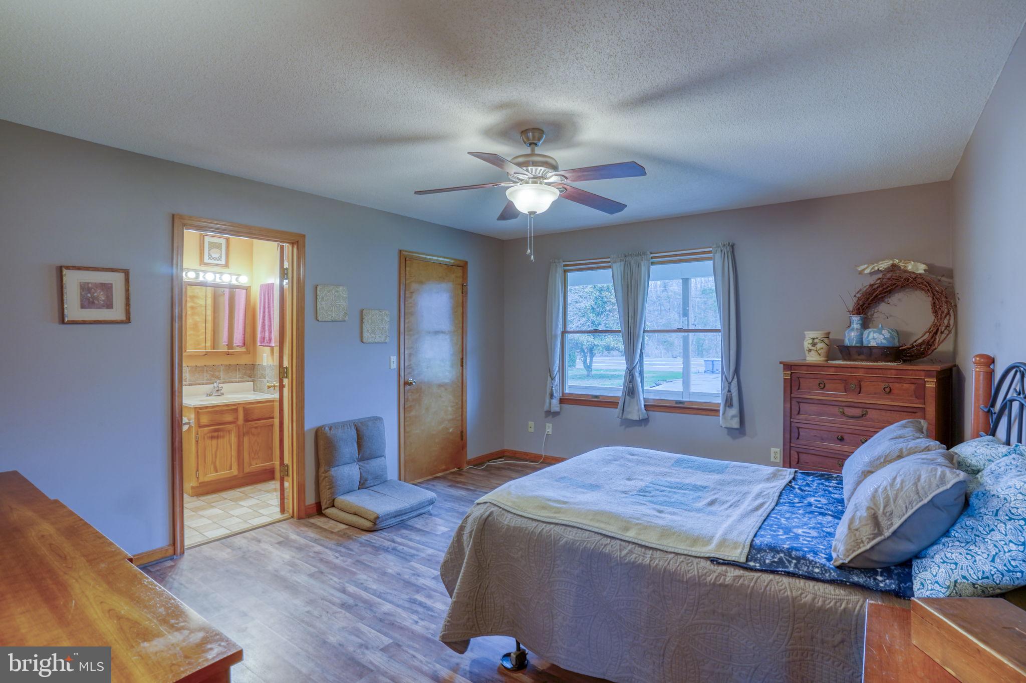 1916 Hartly Road Hartly, DE 19953 - Photo 23 of 44 a bedroom with a bed dresser and a window