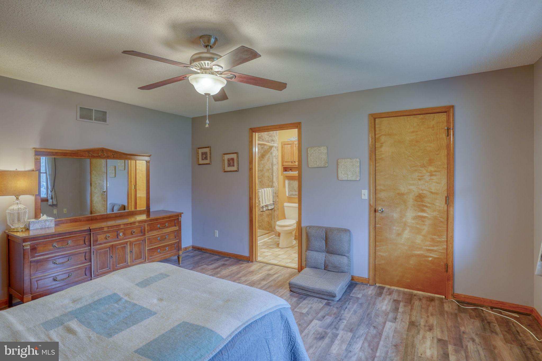 1916 Hartly Road Hartly, DE 19953 - Photo 25 of 44 a bedroom with a bed and a dresser
