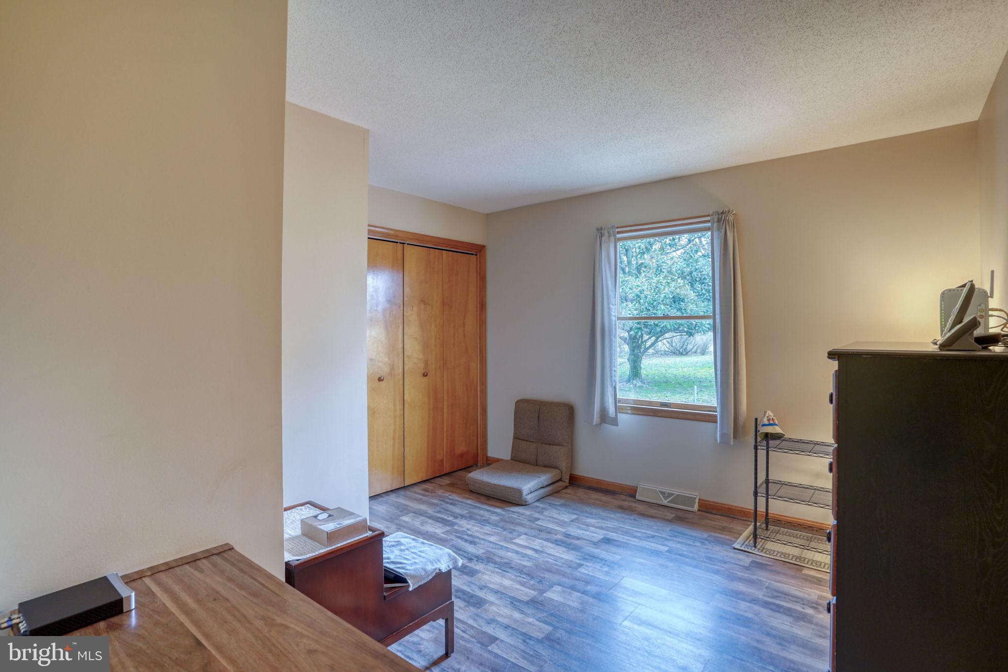 1916 Hartly Road Hartly, DE 19953 - Photo 29 of 44 an empty room with wooden floor and windows