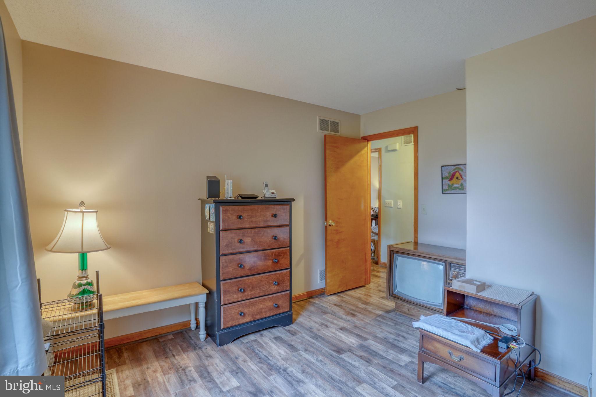 1916 Hartly Road Hartly, DE 19953 - Photo 31 of 44 a bedroom with furniture and wooden floor