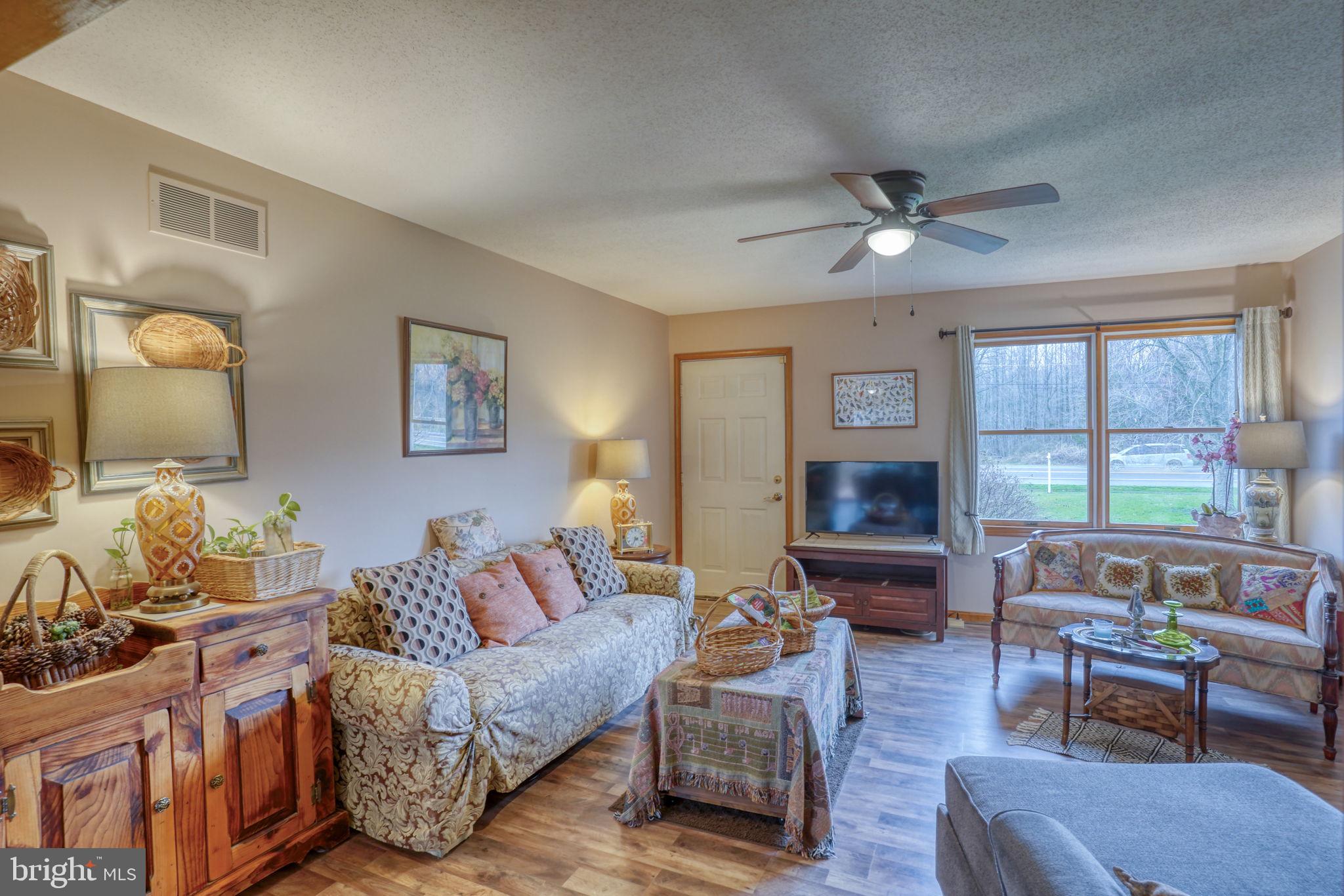 1916 Hartly Road Hartly, DE 19953 - Photo 10 of 44 a living room with furniture and a large window