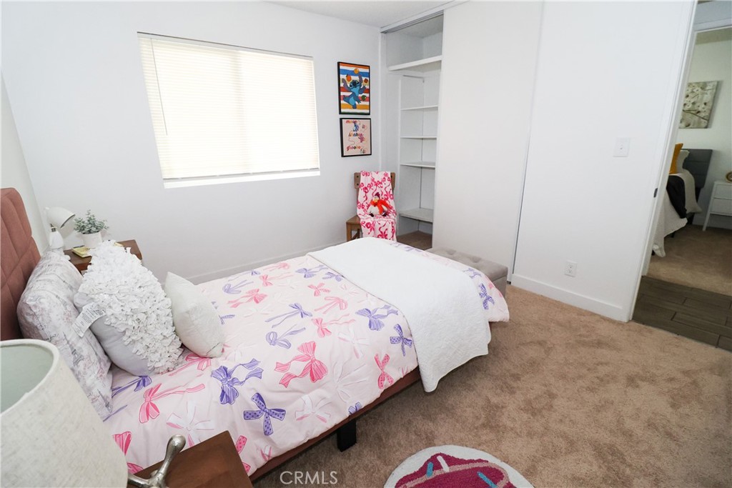 1161 Blue Ridge Lane Colton, CA 92324 - Photo 19 of 36 a bedroom with a bed and a dresser