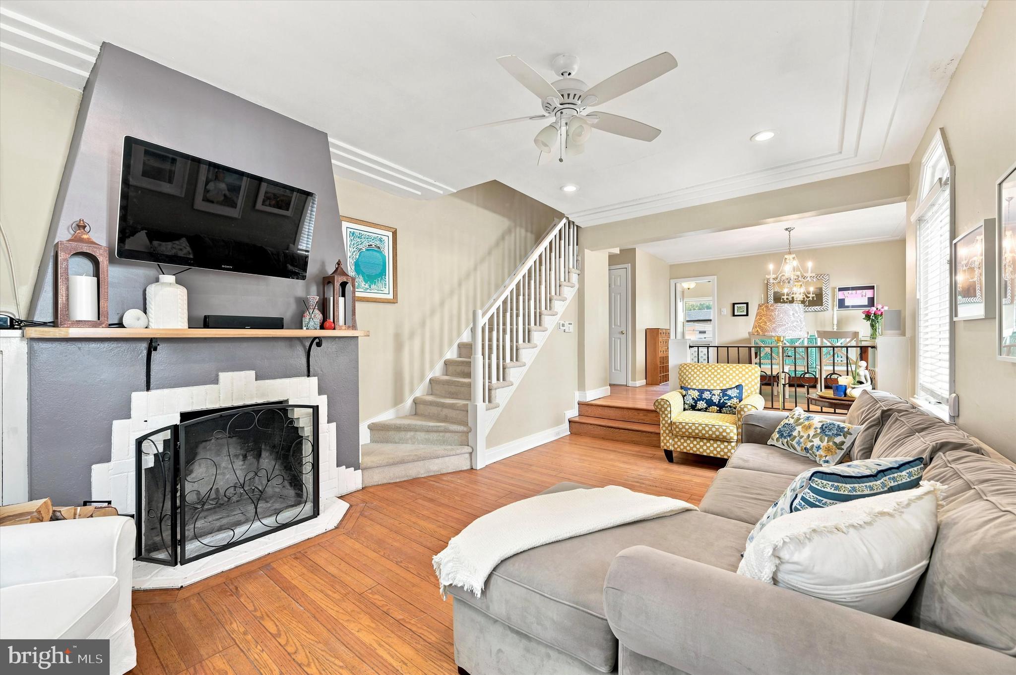 1468 Hampstead Road Wynnewood, PA 19096 - Photo 6 of 29 a living room with furniture flat screen tv and a fireplace