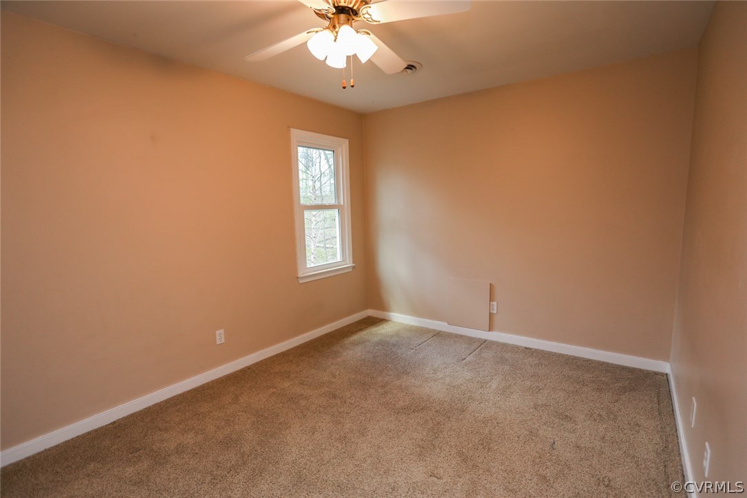 1420 Kingscross Road Midlothian, VA 23114 - Photo 25 of 48 an empty room with windows and fan