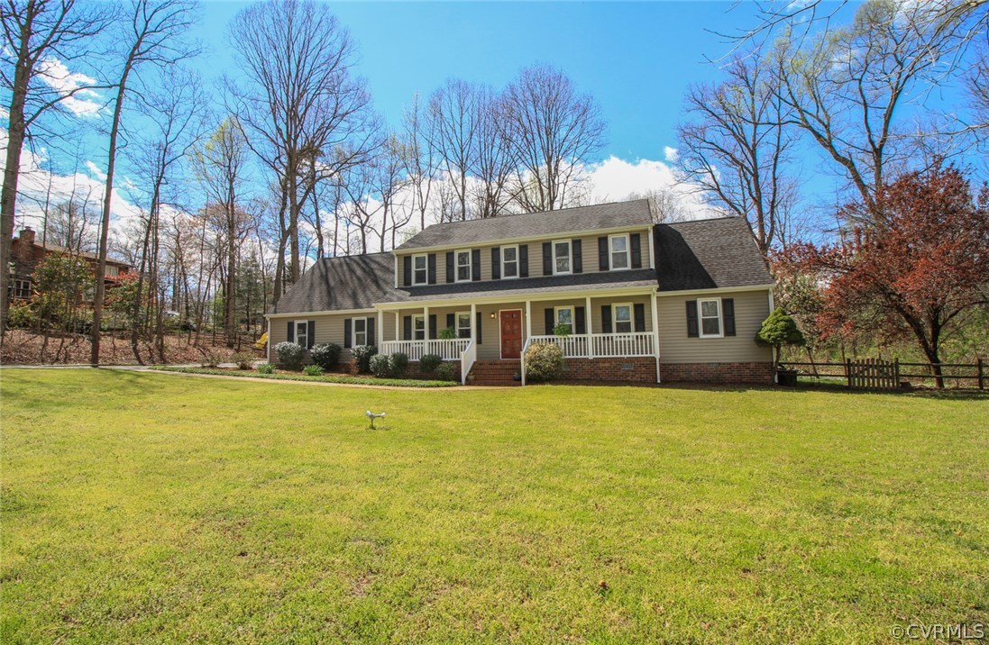 1420 Kingscross Road Midlothian, VA 23114 - Photo 5 of 48 a front view of a building with a yard