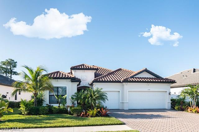 a view of a house with a yard and a garden