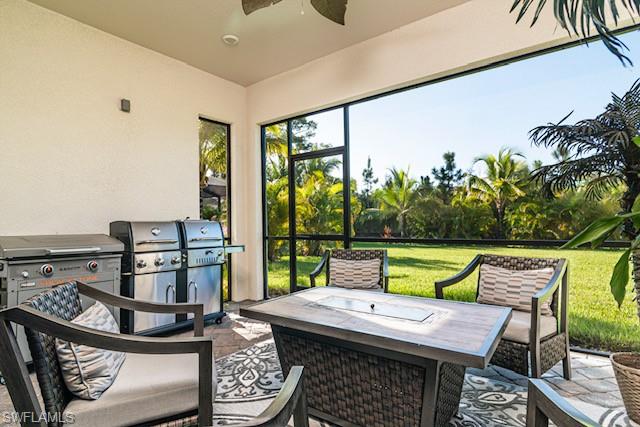 2134 Antigua Lane Naples, FL 34120 - Photo 17 of 26 a view of an outdoor sitting area with furniture and garden view