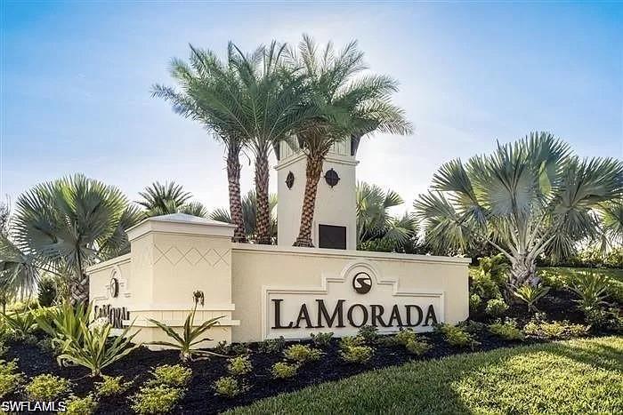 2134 Antigua Lane Naples, FL 34120 - Photo 19 of 26 a sign that is sitting in front of house