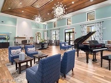 2134 Antigua Lane Naples, FL 34120 - Photo 23 of 26 a living room with fireplace furniture and a wooden floor