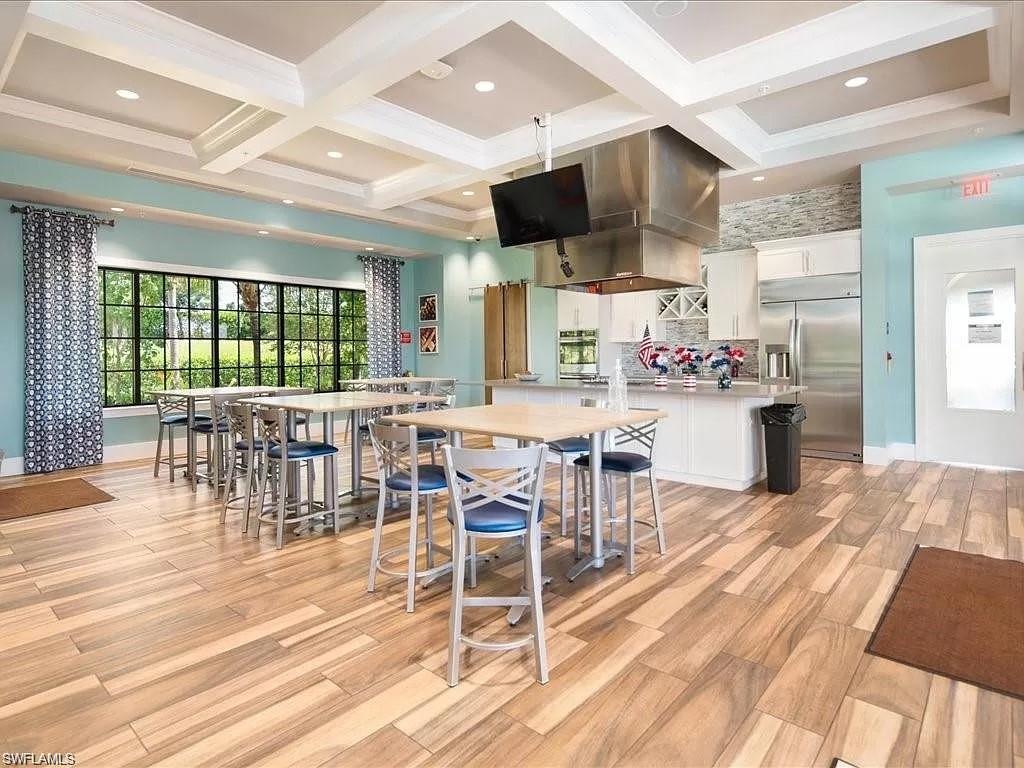 2134 Antigua Lane Naples, FL 34120 - Photo 24 of 26 a view of a kitchen and dining room