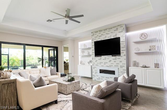 2134 Antigua Lane Naples, FL 34120 - Photo 3 of 26 a living room with furniture fireplace and a flat screen tv
