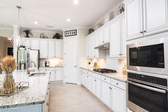 2134 Antigua Lane Naples, FL 34120 - Photo 5 of 26 a kitchen with stainless steel appliances kitchen island granite countertop a sink and cabinets