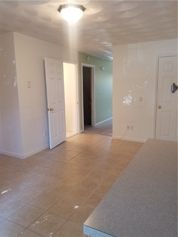152 Samuel Avenue, Unit 152 Pawtucket, RI 02860 - Photo 5 of 21 view from the kitchen, half bathroom and basment doors are on the left, closet on the right, living room straight ahead.