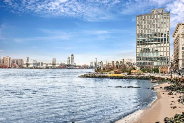 a living room with furniture and large windows