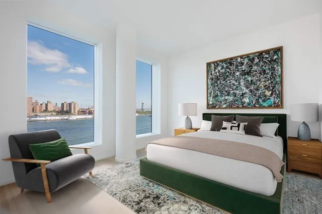 a view of kitchen with cabinets and window