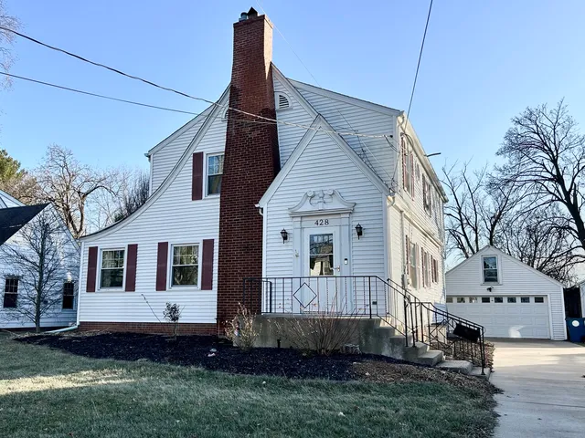 a view of front of house with a yard